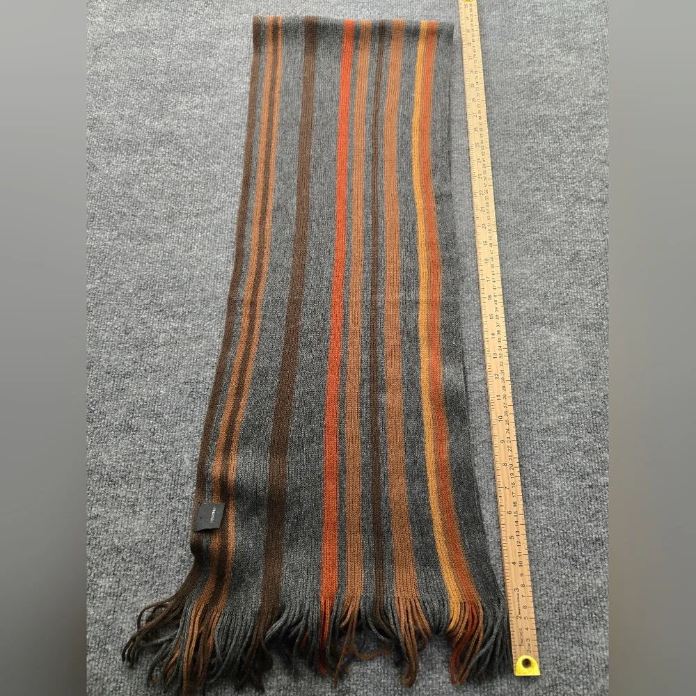 Womens Scarf featuring multicolor stripes and fringe ends. Perfect Pop Of Color‎